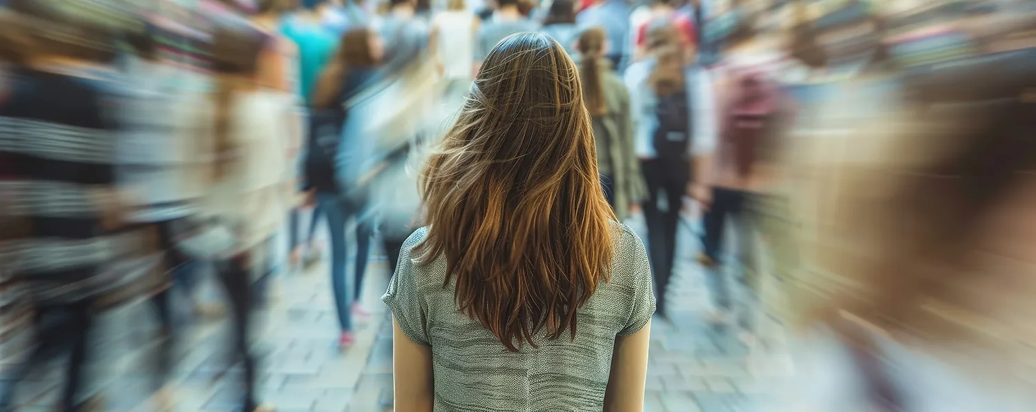 Social anxiety woman in a blurred crowd of people